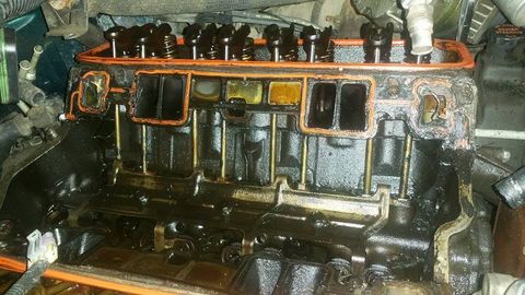 V8 lifter valley with the intake manifold removed and new orange gaskets on the cylinder heads